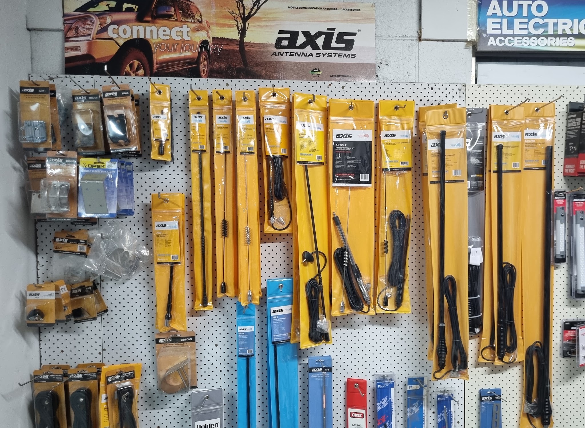 The auto electric accessories pegboard wall, hung with Axis UHF antennas, antenna kits and mounts